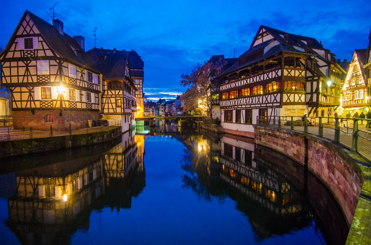 Cobblestone alleys weave between ancient Alsatian tanneries as Franco-German edifices adorn this corridor of the Ill River. #France #night