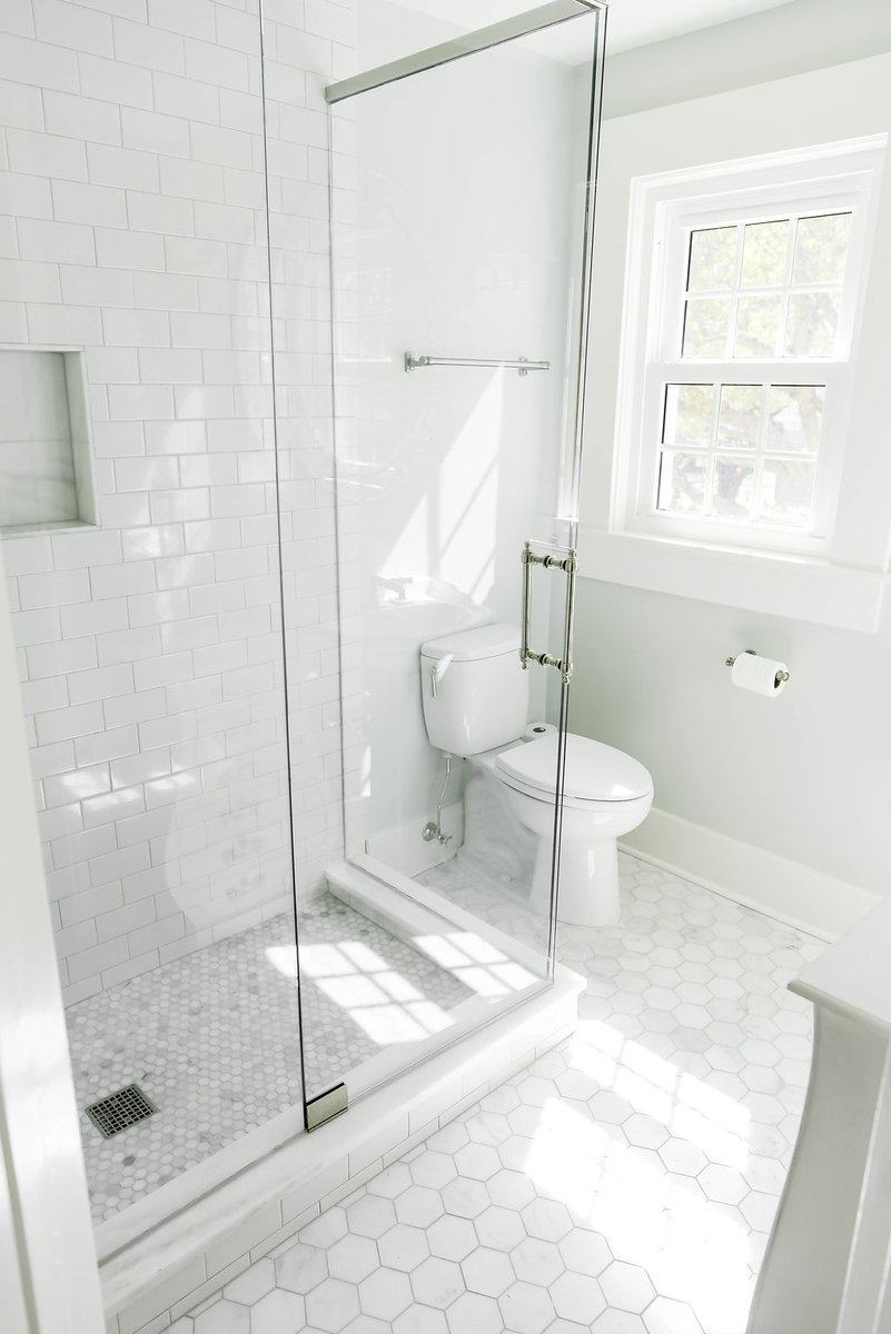 Simple, white guest bathroom for this home in Clearwater, Florida.  #homedecor #bathroom #elegant #design #designbuild #gutandremodel