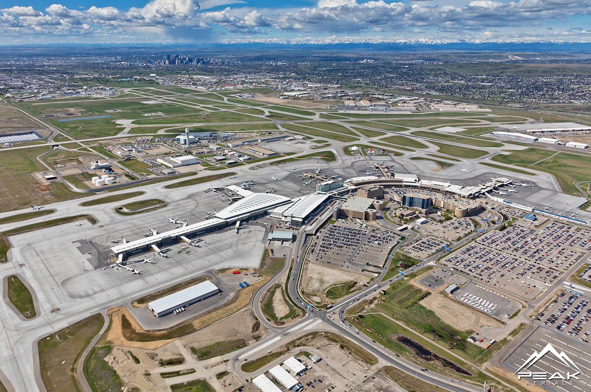 PeakAerial's tweet photo. A great view of Calgary International Airport and its new International Terminal and Hotel. @FlyYYC #YYC #AerialPhotography https://t.co/h1UUhT6C1f