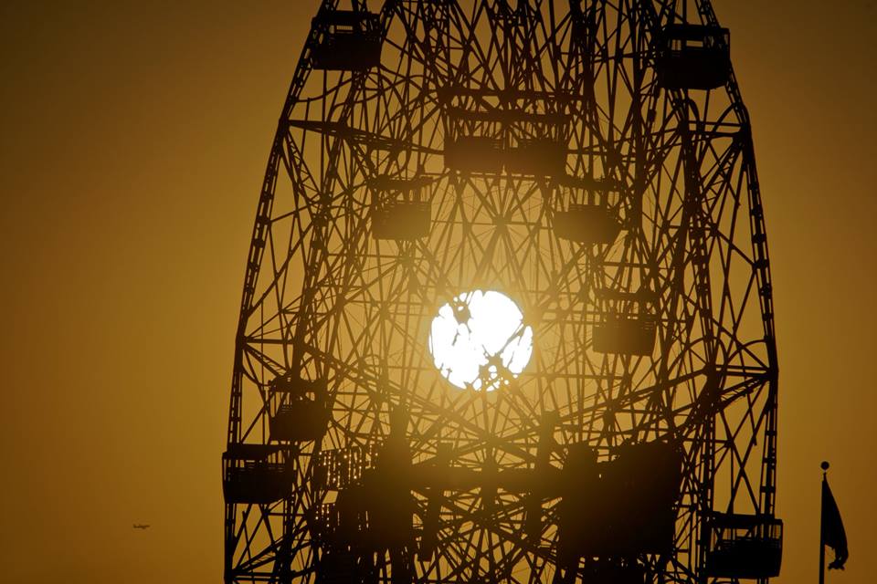 Last sunset of spring! The sun going down behind the landmark #WonderWheel on the eve of the first day of summer. Photo by <a href="/coneyislandjim/">Jim McDonnell</a>
