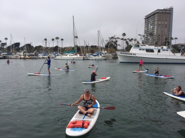 Large group Sup'ing at Oceanside Harbor. Perfect for bday's, group exercise or just hanging out with friends and family. 
#Oceanside