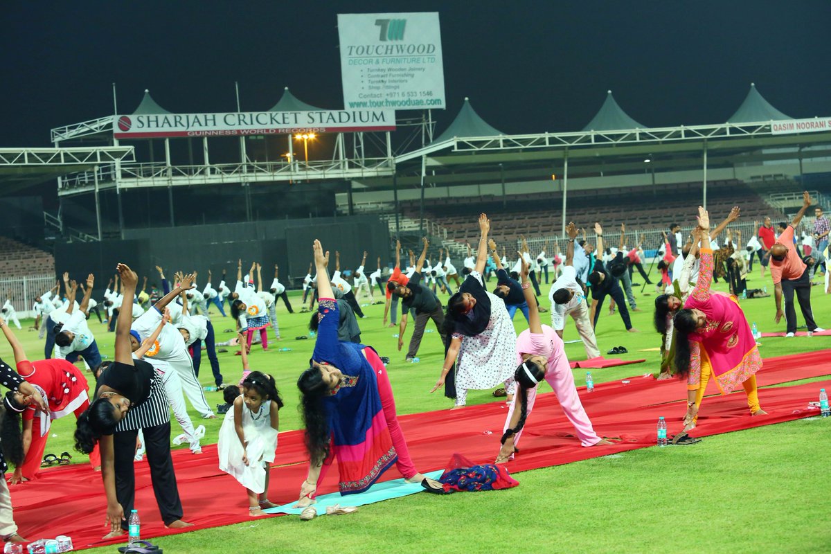 timesofindia's tweet photo. #InternationalYogaDay | Glimpses of Yoga day celebrations at Sharjah Cricket Stadium in UAE

https://t.co/pLcXraAV8f https://t.co/BSWl3xKtU4