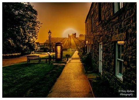 VIEW OF #NORTHUMBERLAND: What a start to the day. #Bamburgh lights up as the sun rises over the castle. A cracking shot from Tony Robson.