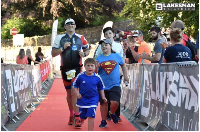 fatMacca74's tweet photo. So special running to the finish like with my two kids &amp; Natè. I couldn't keep up with the little dude #lakesman17 #18forLife https://t.co/dN7i4c8lS3