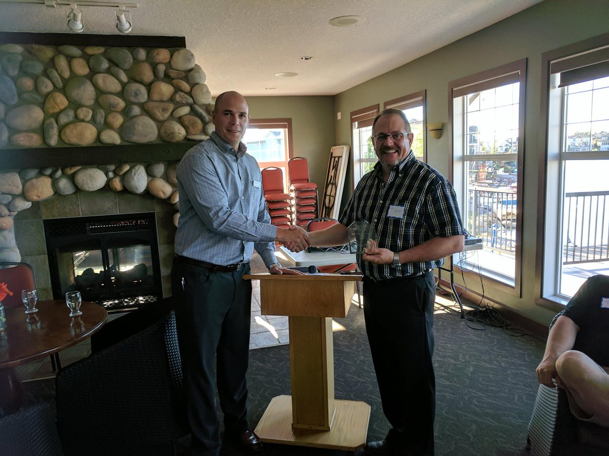 Gerry Wood is the 1st winner of the Mrs. John A. Campbell Award from Sheep River Health Trust. Accepted for Gerry by Ken Brown, Okotoks Ford