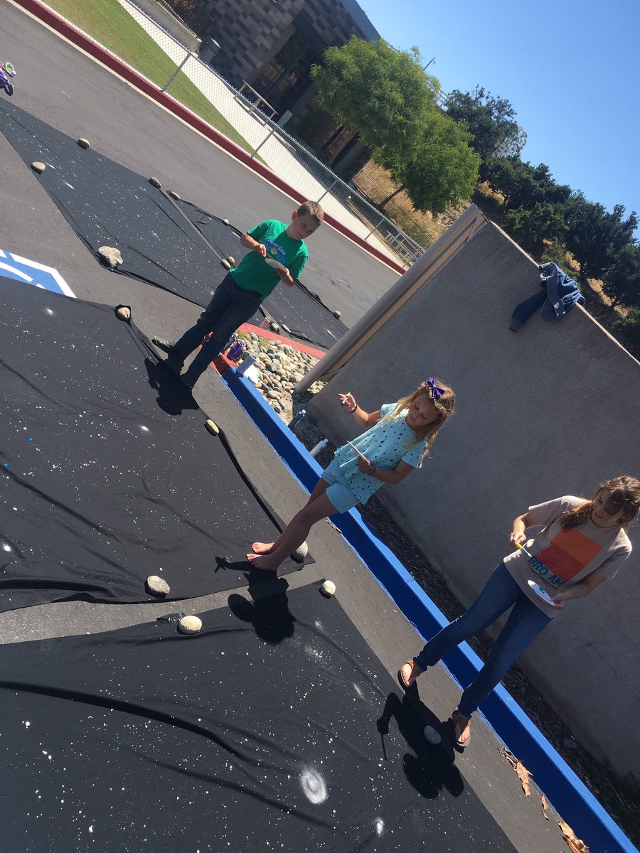 GraceBibleAG's tweet photo. Paint splattering in the parking lot 🖌 https://t.co/7F64CQxIhW