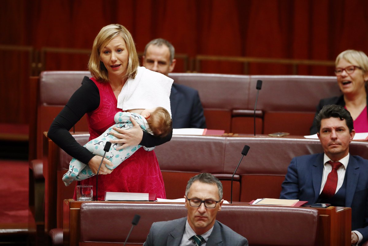 Greens senator <a href="/larissawaters/">Larissa Waters</a> moves a motion while breastfeeding. <a href="/ellinghausen/">Alex Ellinghausen</a> picture.