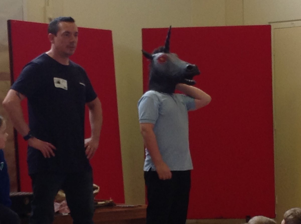 Adam Bushnell and the Evil Unicorn in this morning's assembly.