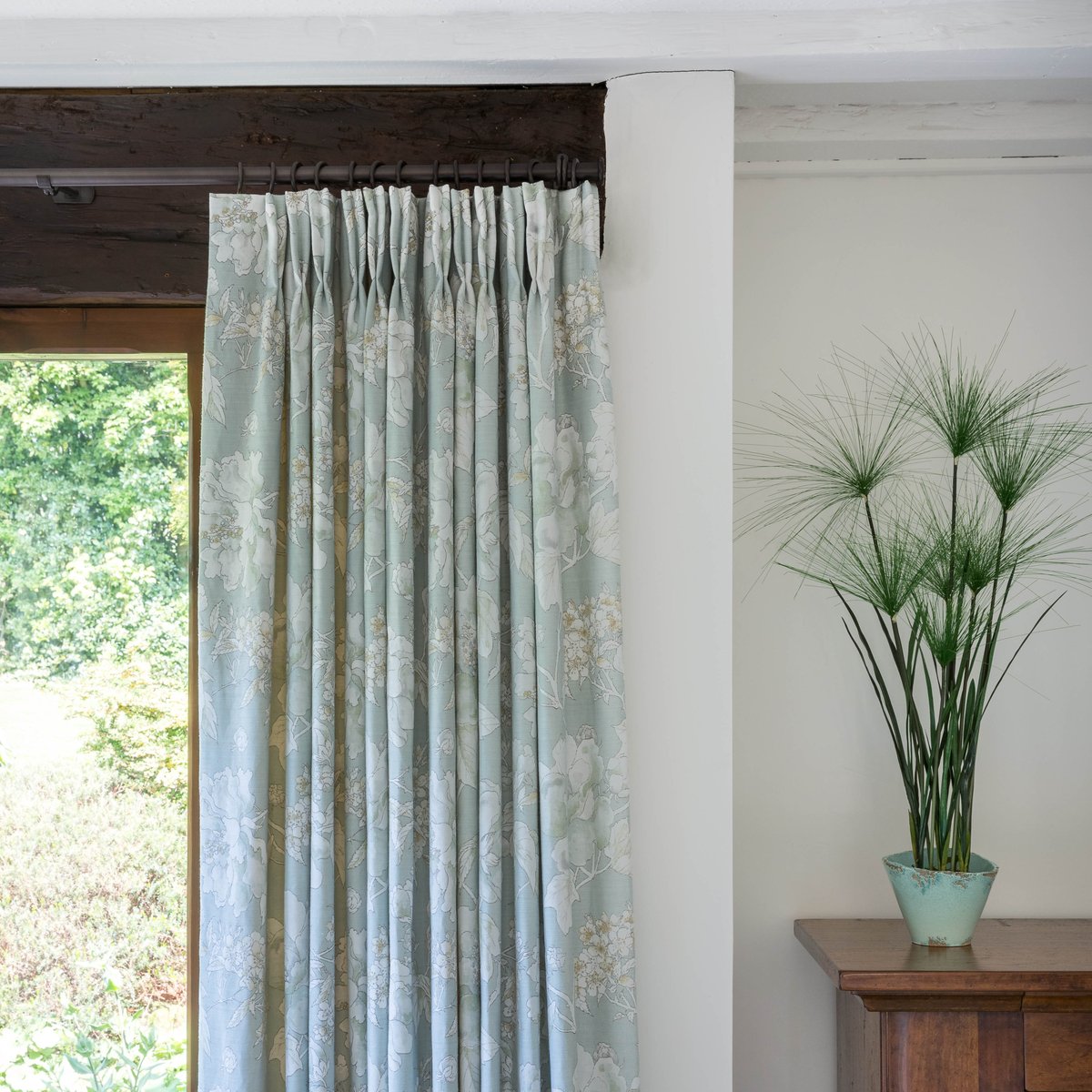 Delicate twin pleated curtains in <a href="/Nina_Campbell/">Nina Campbell</a> Benington fabric brings a fresh, bright finish to one of our customers' homes...