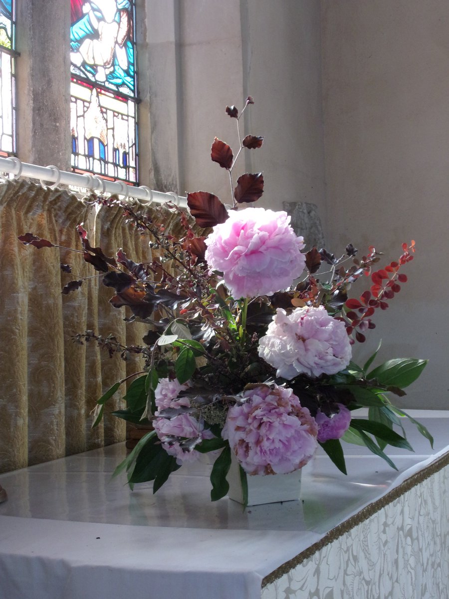 Lbeachringers's tweet photo. Lovely flower arrangement with perfect chiaroscuro on Enid's altar at All Saints' Landbeach https://t.co/OwviGrWJvJ