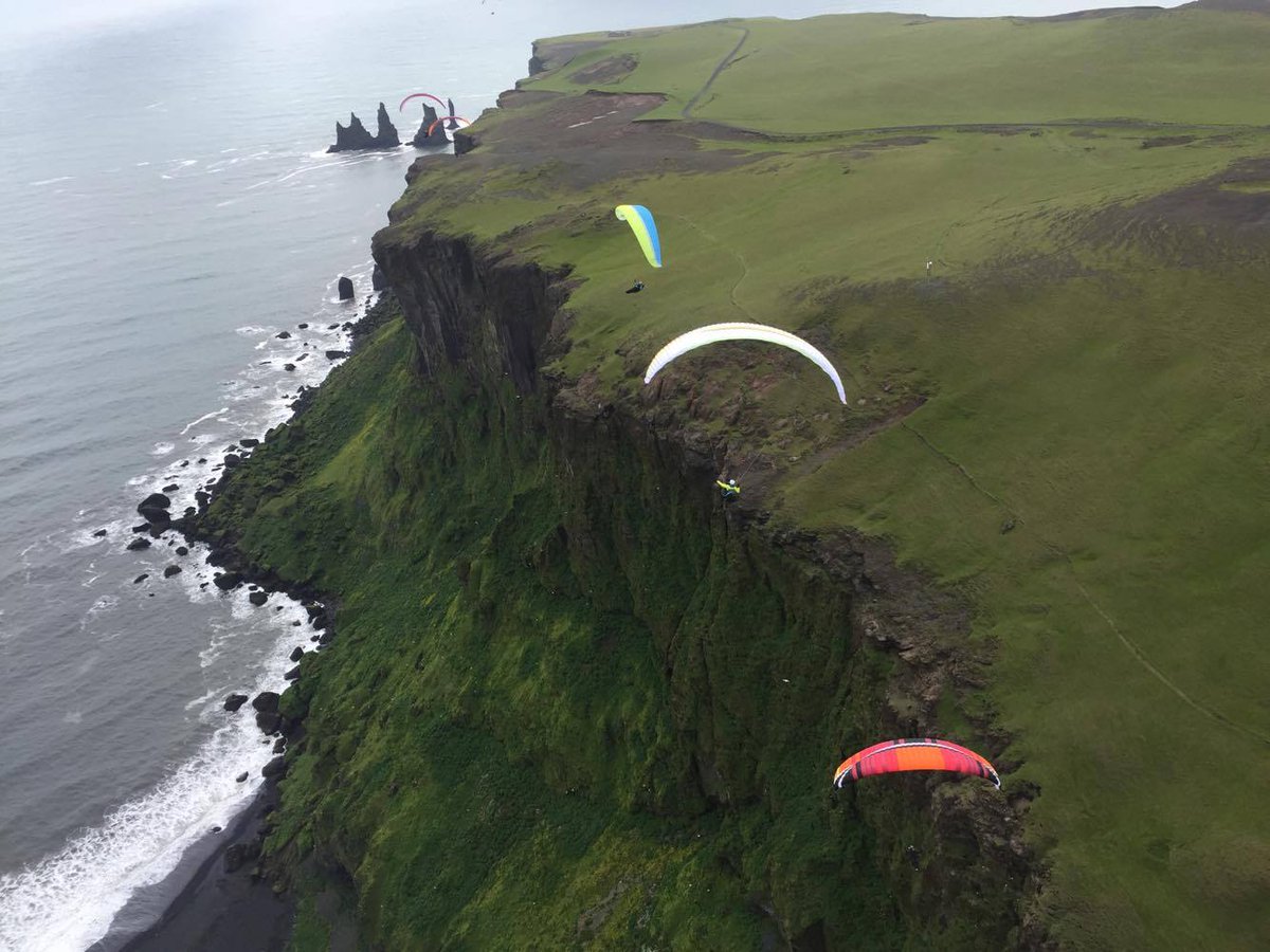 TA_iceland's tweet photo. #midsummer mid-flight mid-air #trueadventure #vik #iceland #paragliding #summertime https://t.co/SXF3ZlMdOX