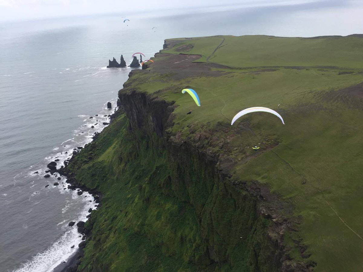 TA_iceland's tweet photo. #midsummer mid-flight mid-air #trueadventure #vik #iceland #paragliding #summertime https://t.co/SXF3ZlMdOX