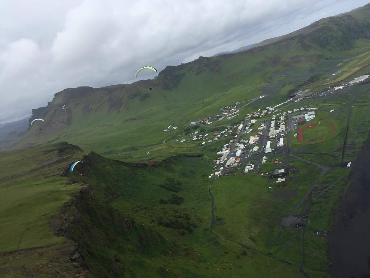TA_iceland's tweet photo. #midsummer mid-flight mid-air #trueadventure #vik #iceland #paragliding #summertime https://t.co/SXF3ZlMdOX