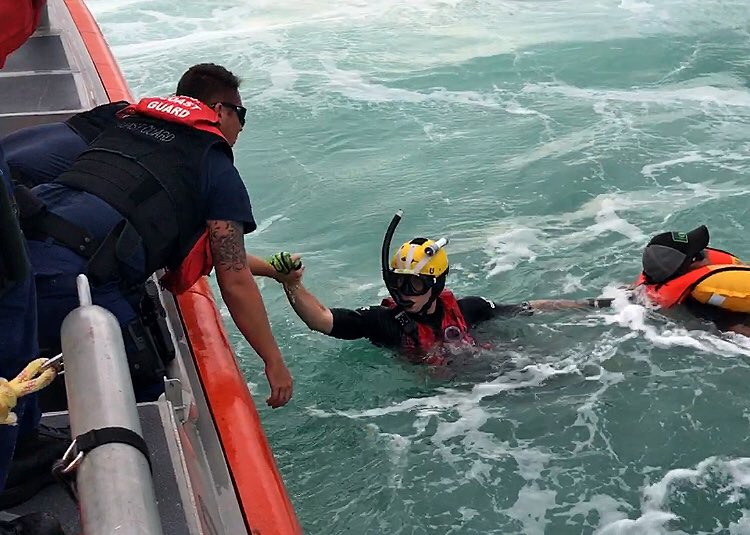 USCG's tweet photo. #USCG air &amp; boat crews from @USCGSoutheast rescued 4 people after their 19-foot boat capsized off FL coast: https://t.co/cO0GCQTW7g https://t.co/pK2RPjTVic