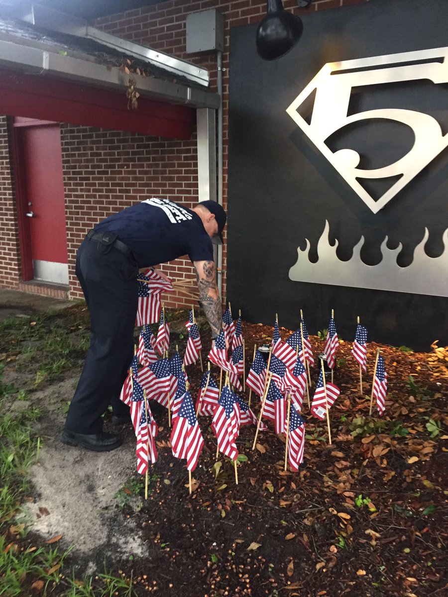 OrlandoFireDept's tweet image. Station 5 firefighters honor the 49 lives lost at Pulse with 49 flags in the shape of a heart. #OrlandoUnitedDay