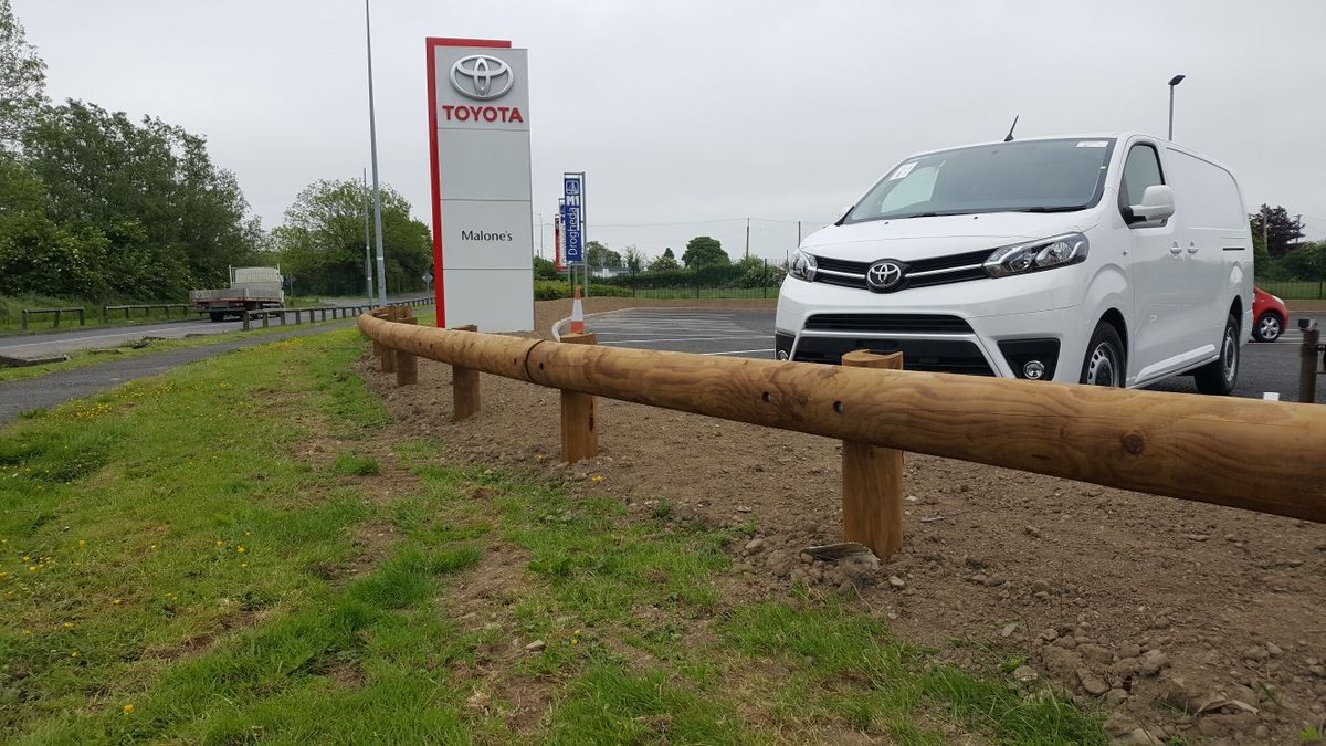 When two leading companies meet : Tertu steel backed timber guardrail securing Toyota dealership parking close to Drogheda ( Ireland ).
