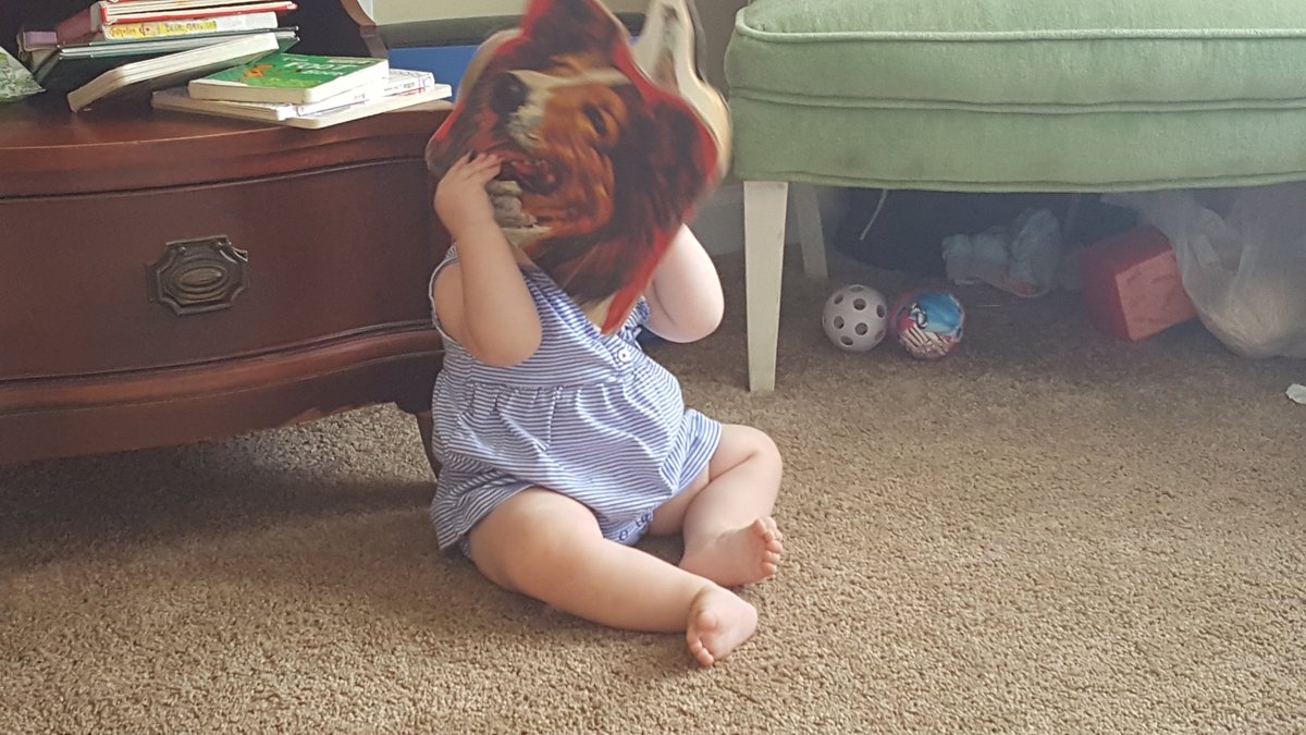simplyorganicT's tweet photo. Our 9 month old loves books. This is how she reads. She's the chutest! #Momof5 #MomminInGA https://t.co/jGDRXMRKzE