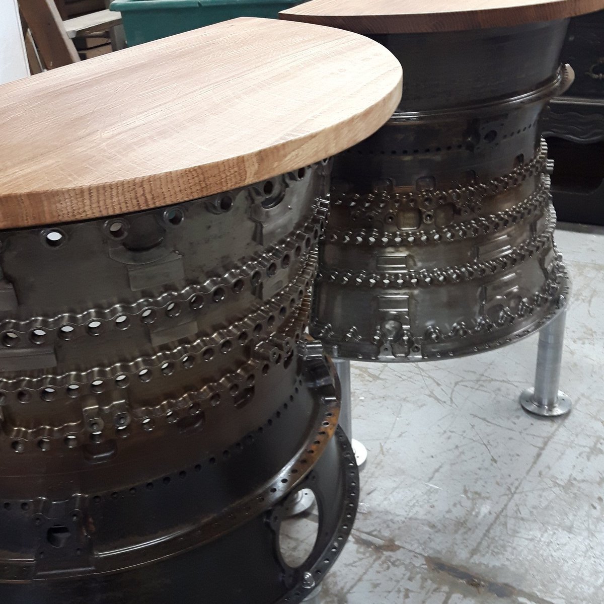 DapprFurniture's tweet photo. A pair of console tables made from  jet engine cases, oak and league from Boeing link pins #ecocreatehour #upcycled #aircraft https://t.co/91eABDUR0a