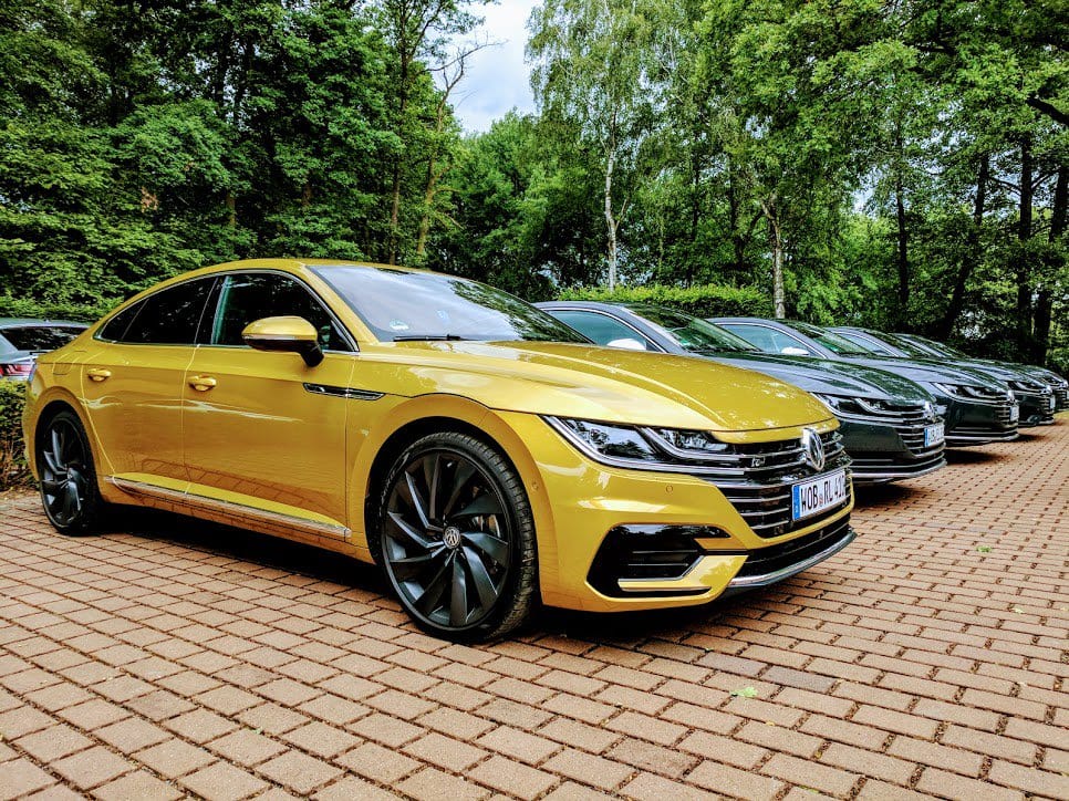Eye catching from any angle. Check out the all-new Arteon in Turmeric Yellow. #VWArteon