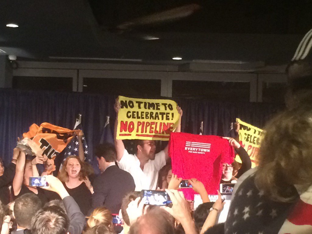 Anti-pipeline protesters commandeered the stage at Northam's victory party. "This is no time to celebrate!"