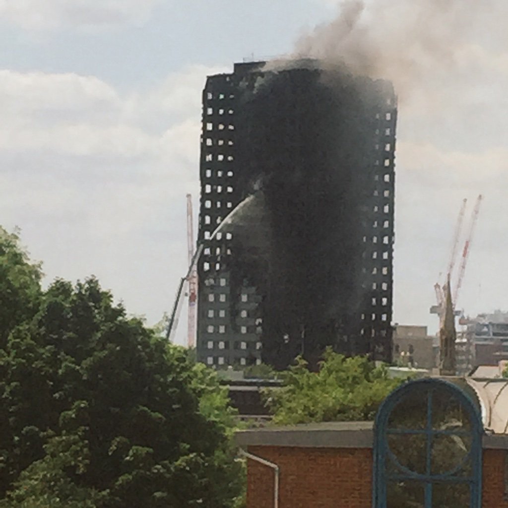 Such a tragic fire #GreenfellTower neighbours to our offices, the view from our window. Hardy anything left (1/2)