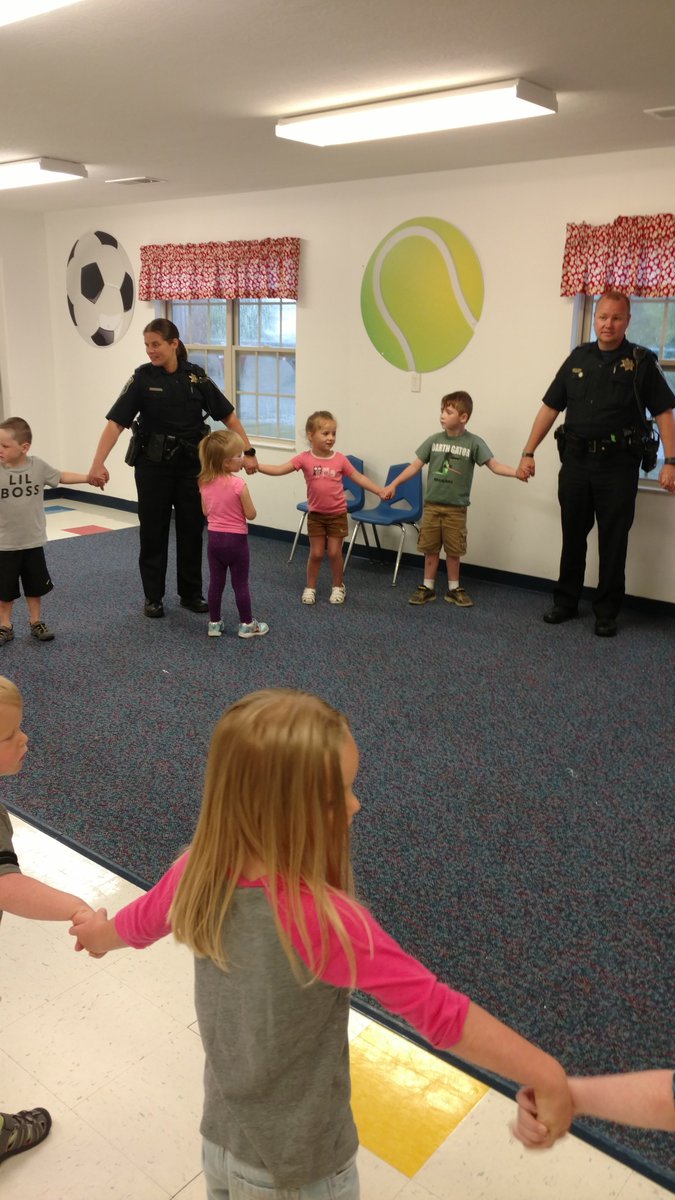 HamiltonTwpPD's tweet photo. Ofc. Wall &amp; Workman hanging out @RainbowCCC today reading books and having fun! https://t.co/6YOQGgaoYc
