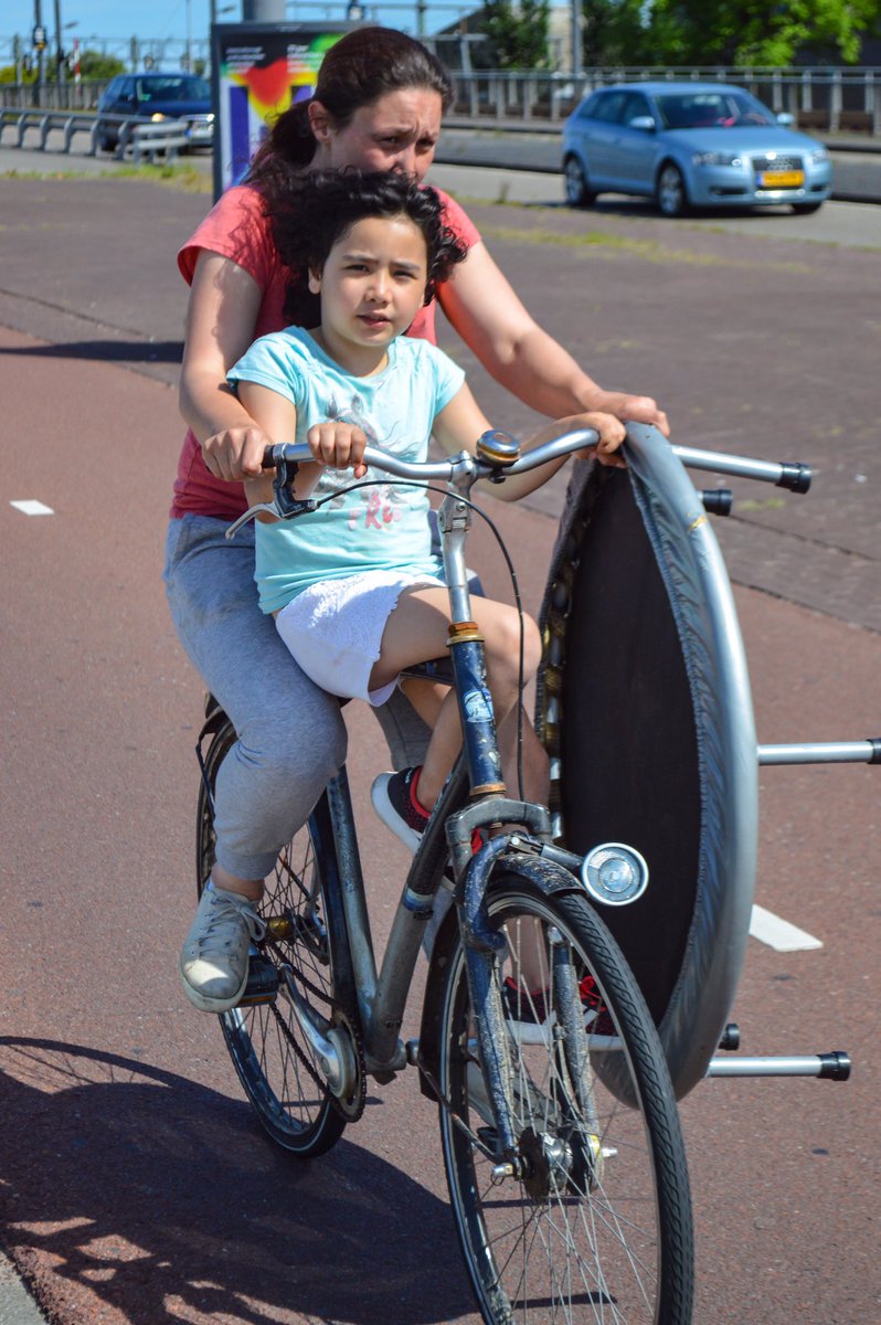 Amsterdam at rush hour is full of delightful sights, not the least of which are the moms effortlessly shuttling their kids home from school.