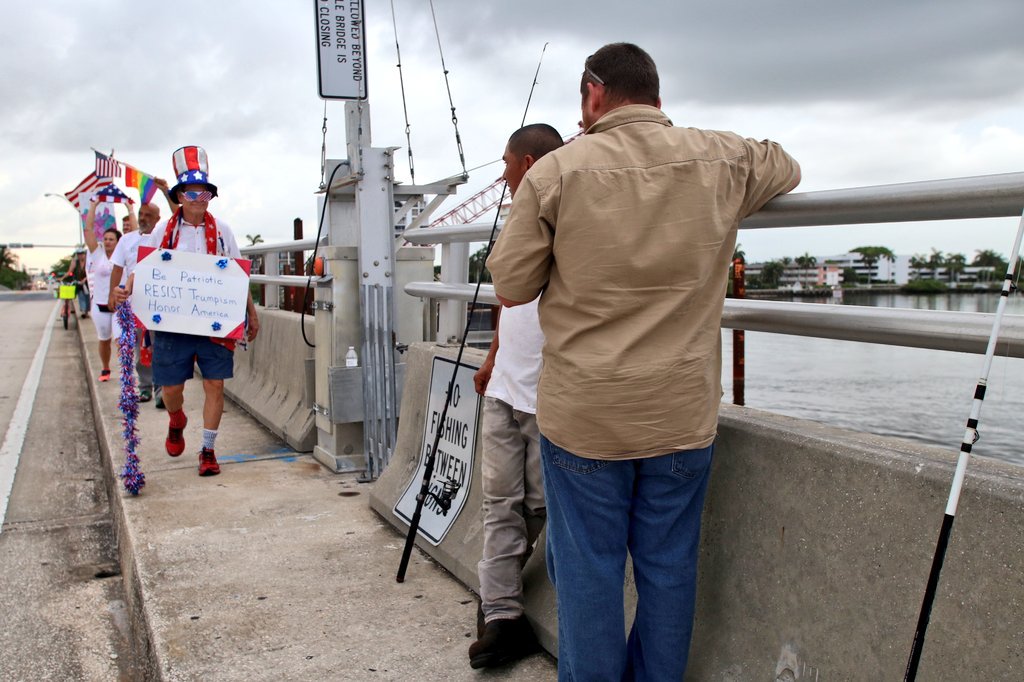 MindOfCarlita's tweet photo. Fishermen were surprised to see picket signs and flags on Southern Bridge #artistmarch @ShinySheet @pbpost https://t.co/CztfGvf4jO