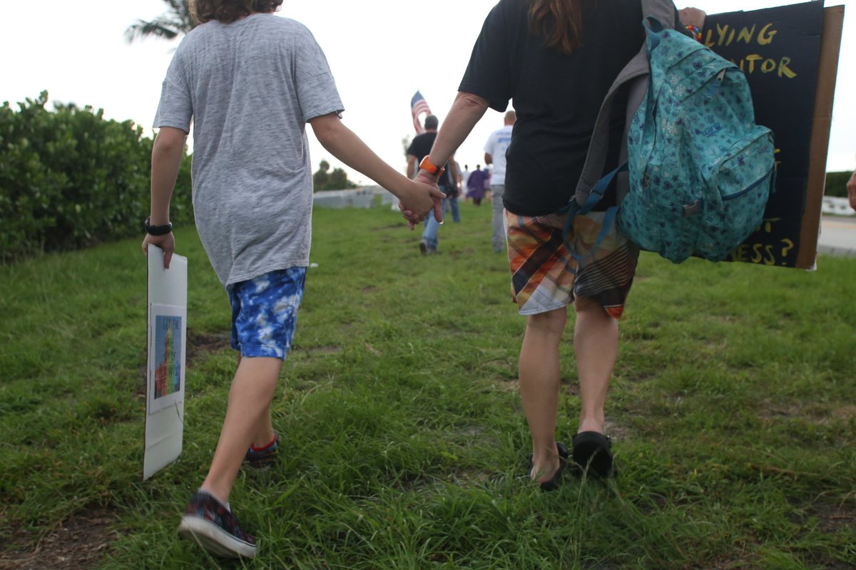 MindOfCarlita's tweet photo. Katie Carlsson and her son came from Palm City for the #artistmarch Their primary concern is environmental policy @ShinySheet @pbpost https://t.co/1ERSV1x5NM