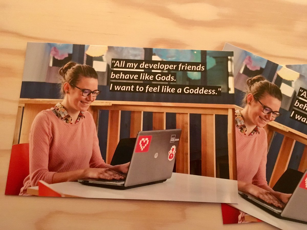 A postcard of a woman at a computer. "All my developer friends behave like Gods. I want to feel like a Goddess."
