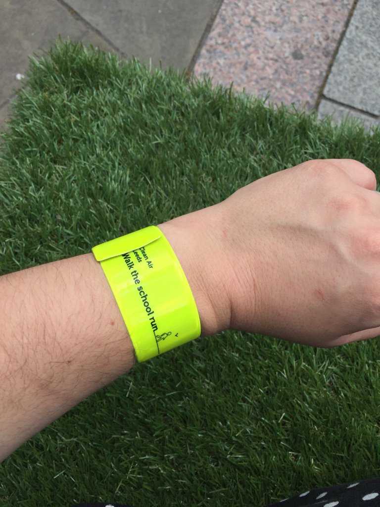 cleanairdayuk's tweet photo. Fluorescent arm bands being handed out across #Leeds to encourage walking rather than driving. #NationalCleanAirDay https://t.co/XUDy3V90je