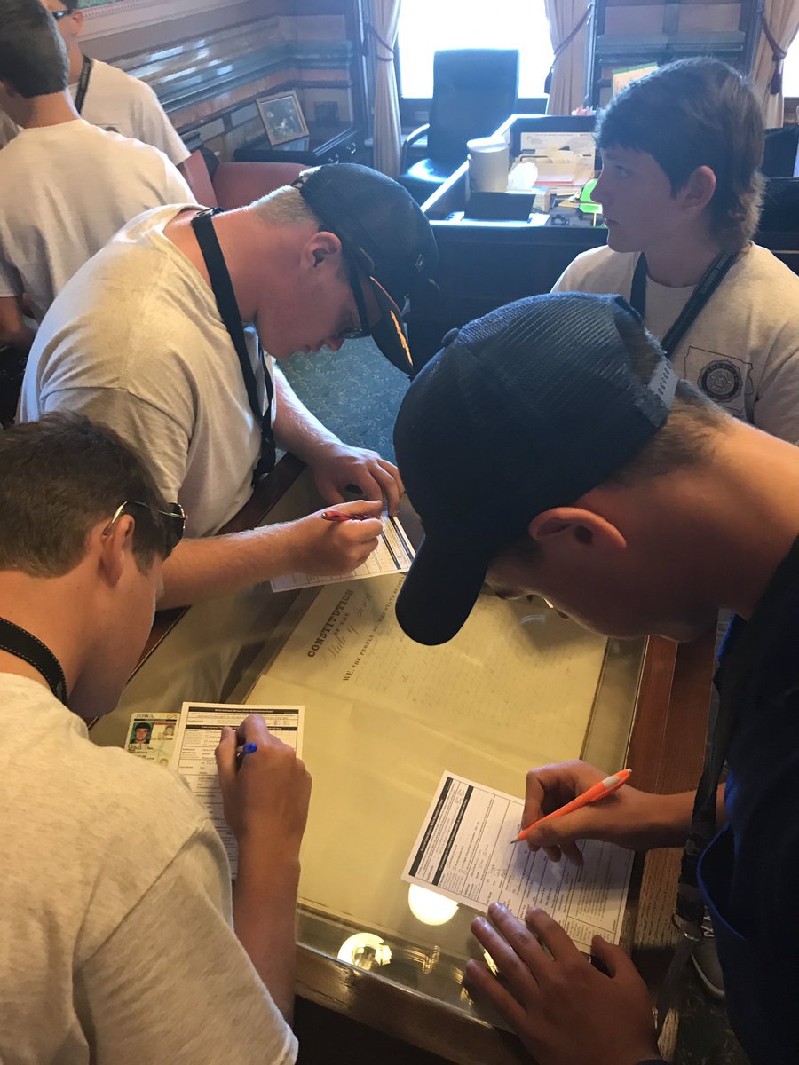 IowaBoysState's tweet photo. #HawkeyeBoyState registering to vote in the @IowaSOS office on top of the original 1857 Iowa Constitution https://t.co/6j0b0ExbSN