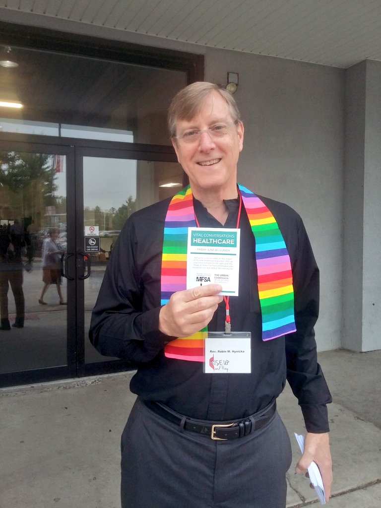 .<a href="/robinhynicka/">Robin Hynicka</a> is sporting a <a href="/metropolitanumw/">UMW of DC</a> rainbow stole and some invites to a lunchtime convo on healthcare! #epaumc17