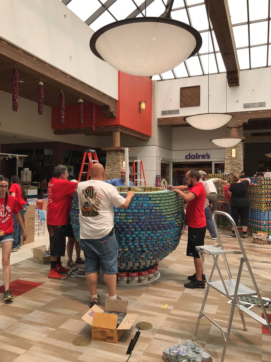 StudioSWArch's tweet photo. With noon approaching, another layer of our globe goes on! Can you see it taking shape yet?! 🌎🎓📚 #CanSantaFe2017 #CanstructionSantaFe https://t.co/SvGWSZH70v