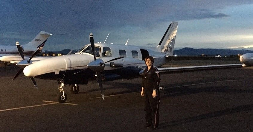 REACHAirMed's tweet photo. Flight Nurse Brittany Countryman hanging out in front of the REACH 53 fixed wing. #FixedWingFriday #FridayFeeling #Aviation https://t.co/mc1lGQ03lt