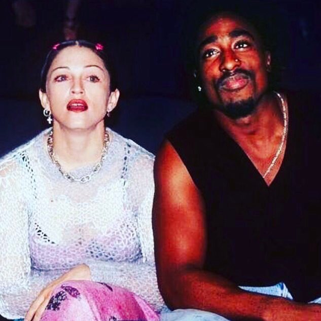 Madonna's tweet photo. Happy Birthday Tupac! 🎉🎉🎉🎂🎂💘Not sure what my dumb ass facial expression is all about. 🤡maybe we were at the circus. 🎪 https://t.co/leN0vkrlig