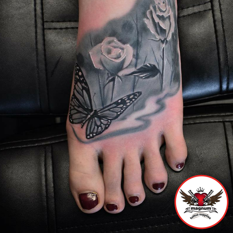 MagnumTattoo's tweet photo. Ink Envy Martin Thornton did this rose &amp; butterfly foot cover up using #magnumtattoosupplies 💐 #worldfamousink #butterflytat #rose #rosetat https://t.co/Y43q2CqmQg