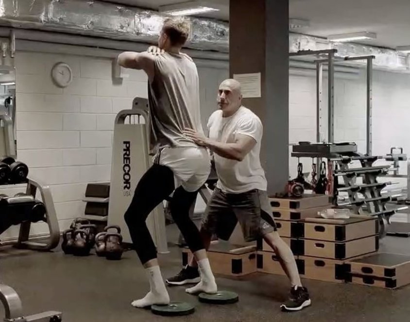 NBAInjuryR3port's tweet photo. Sixers and Celtics out here building super teams and Kristaps is in Latvia wearing a diaper while a cut rate Vin Diesel massages his belly. https://t.co/MSSc3dQ07K