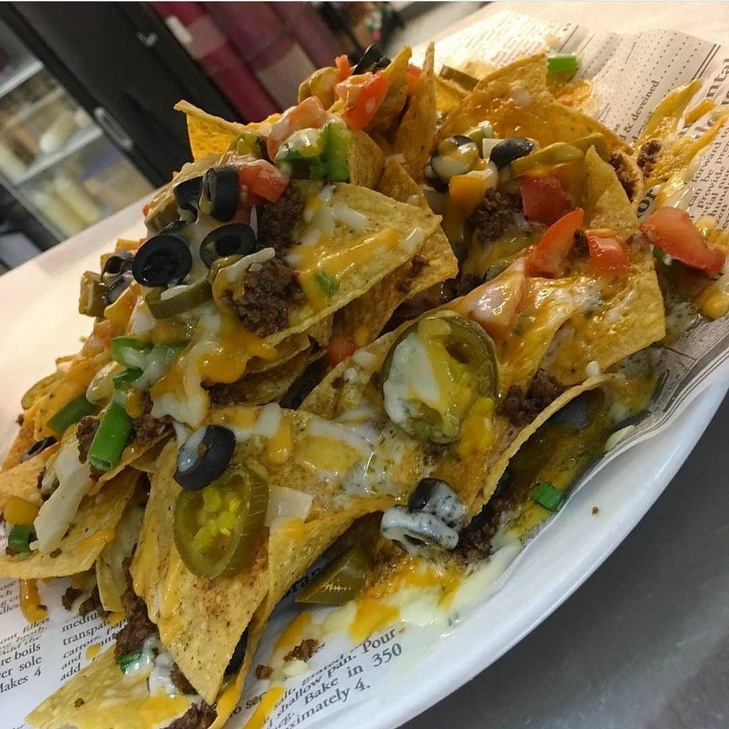 FoodYYC's tweet photo. Love nachos. Think you could down the whole plate? @tudorrosecalgary ⏩ https://t.co/5H2xQf1eOF #yyc #foodyyc #yycfood https://t.co/hHI6ytcBPP