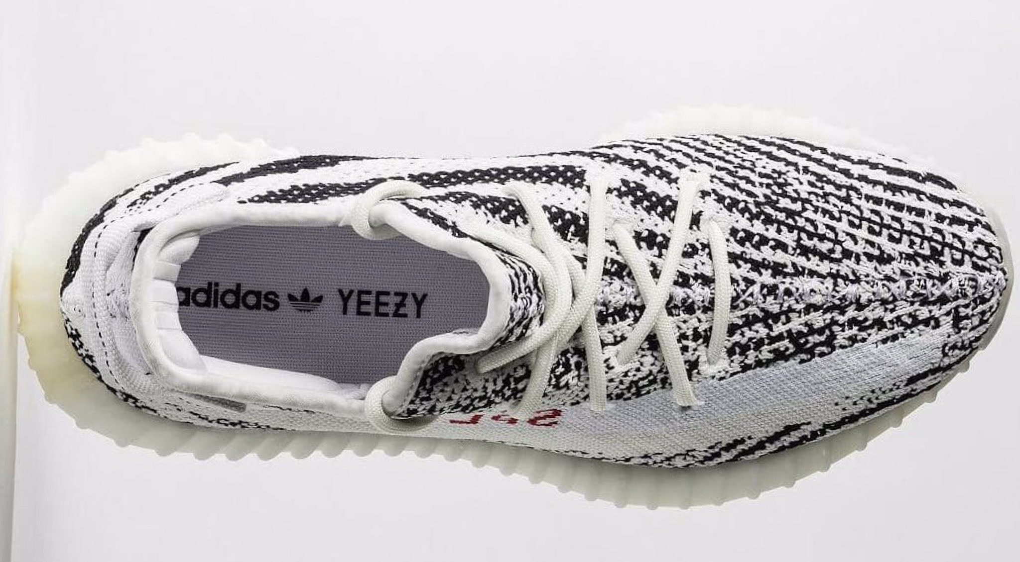 champs sports yeezy zebra