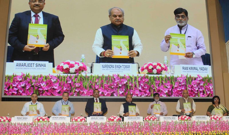 PIB_India's tweet photo. Union Minister @nstomar releases publication, at Award Distribution function in recognition of Effective Initiatives in Rural Development. https://t.co/rqBd8sDW9E