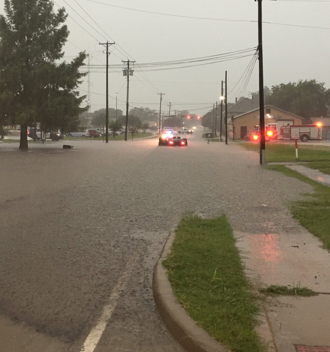 Crews working a stranded motorist in high water.