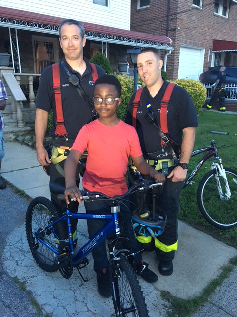 FDNY's tweet photo. #FDNY members from #Ladder158 #Engine311 gift boy new bike after disassembling his old one to treat his injury https://t.co/I21tP29X07 https://t.co/Hd37mQFdbi