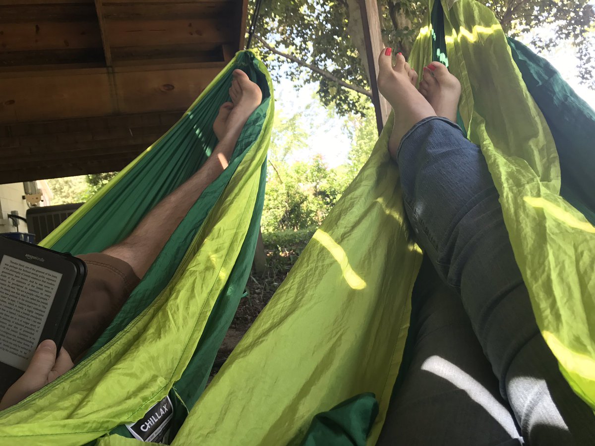LadyBrik's tweet photo. His&amp;hers, hammock-style. 📖☀️ #GoodreadswithaView @brikenjon https://t.co/egFS1KGsIR