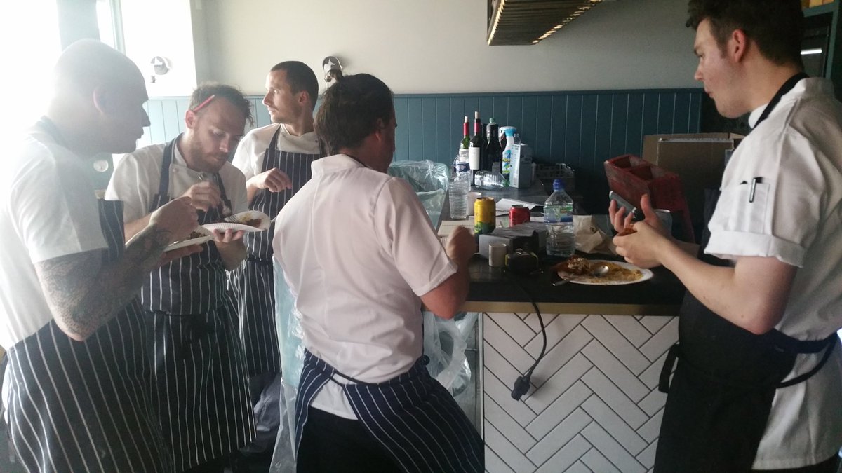 pascerebrighton's tweet photo. The team tucking into dinner after a hard days work courtesy of the wonderful @chefkanthi @curryleafcaff https://t.co/NuQLa8Zt3k
