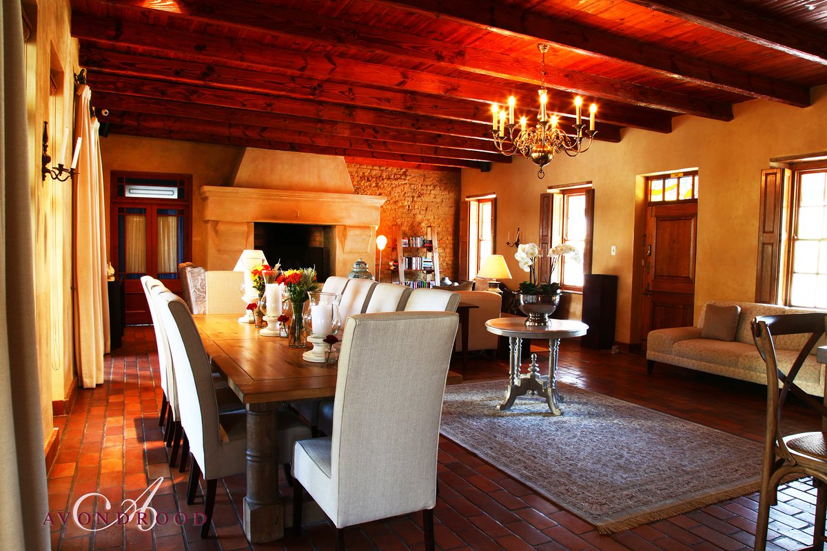 Inside the main house you can relish in the #spaciouslounge next to the grand #fireplace. bit.ly/2qW2P7H #capewinelands