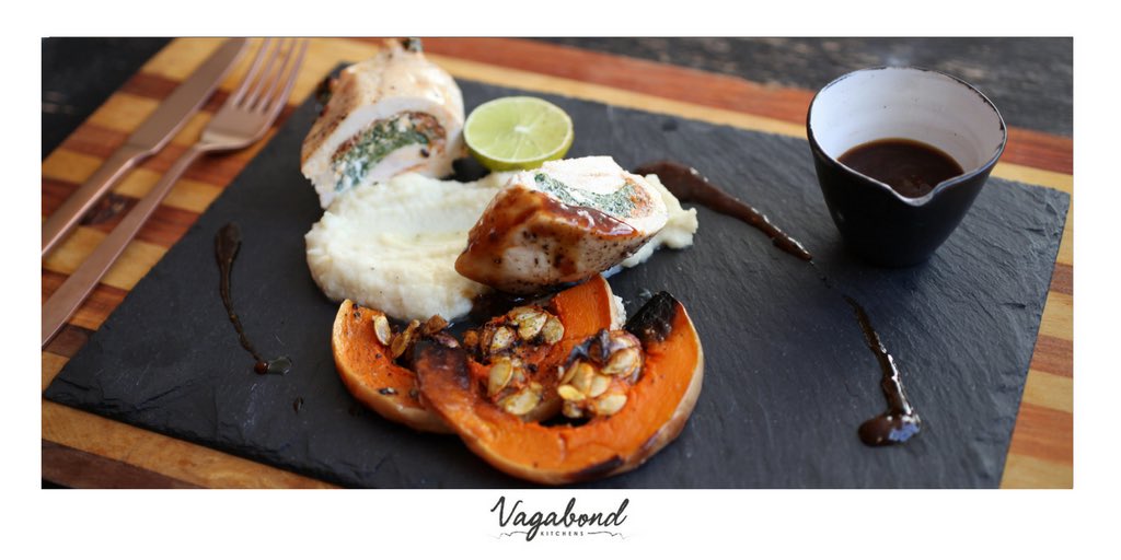 Spinach, feta and sun dried tomato pesto stuffed chicken breast on a bed on creamy cauliflower mash served with roasted butternut.