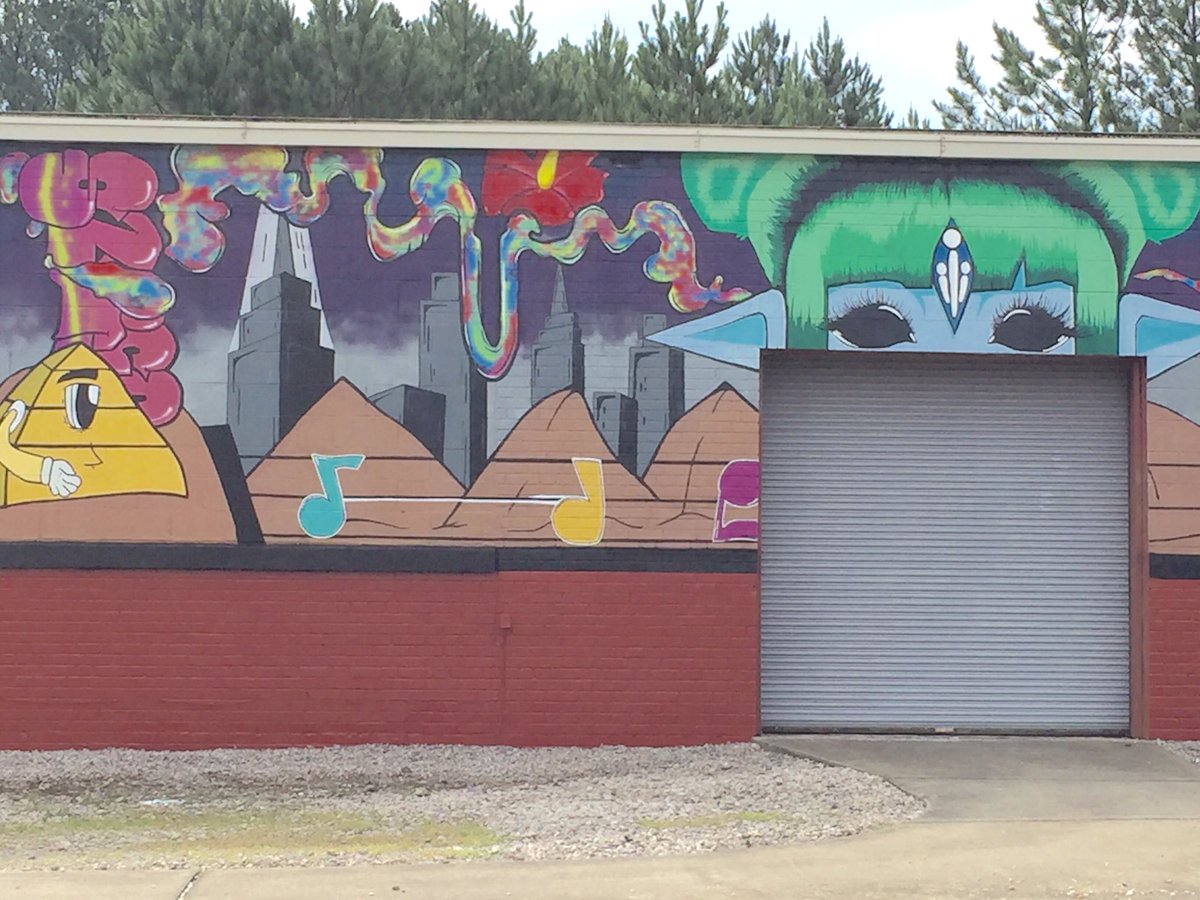 The completed mural at the VCS distribution center, showcasing the talents of SVHS art students, features bright colors and unique images!