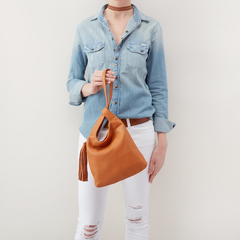 ChattanoogaShoe's tweet photo. #Bohemian inspired, finished with a fringe tassel. This cinched wristlet is designed for the stylish wanderer @BaggeryStore https://t.co/1dA3HhStGh