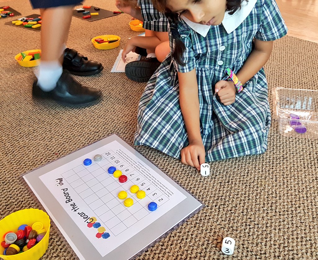 EYideas1's tweet photo. Amazing maths happening today! Can you place your counters and clear the board by rolling the dice? @Reception_TTS @TanglinTrust #maths https://t.co/In5ZfyetUn
